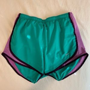 green and purple nike shorts